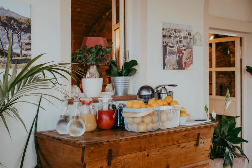 a table with fruit and other items on it at Agriturismo Podere L'Agave in San Vincenzo