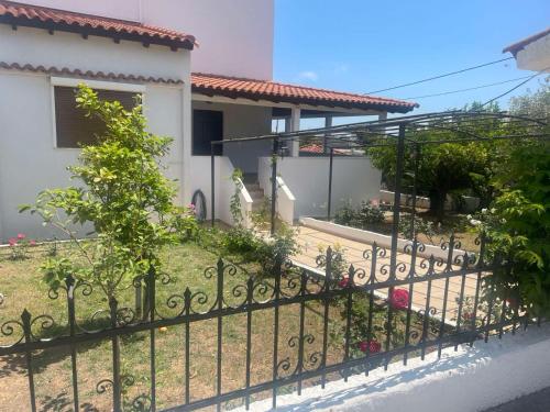 a wrought iron fence in front of a house at Casa de Alegria in Eretria