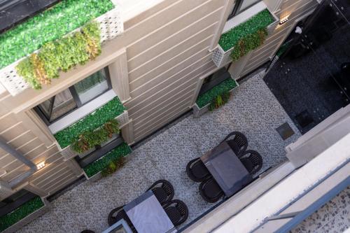 an overhead view of a patio with chairs and plants at Marmaris Saray hotel NEW in Tashkent