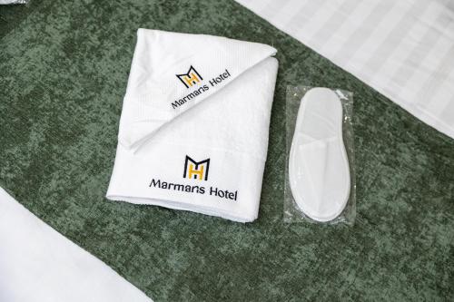 a computer mouse and a napkin on a table at Marmaris Saray hotel NEW in Tashkent