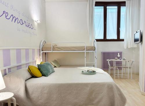 Ένα ή περισσότερα κρεβάτια σε δωμάτιο στο Holihome Le Rose