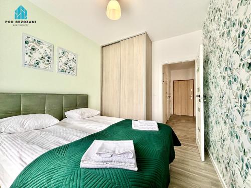 Posteľ alebo postele v izbe v ubytovaní Pod Brzozami Apartamenty Let's Sea Gąski