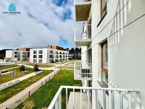 a view from the balcony of a building at Pod Brzozami Apartamenty Let's Sea Gąski in Gąski