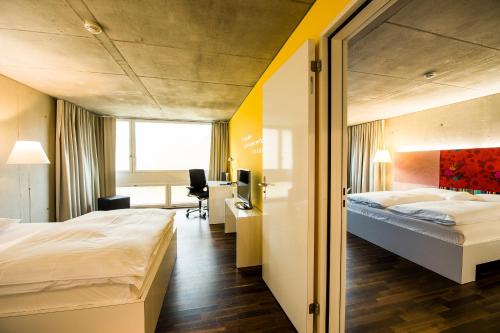 Postel nebo postele na pokoji v ubytování HOTEL APART - Welcoming l Urban Feel l Design