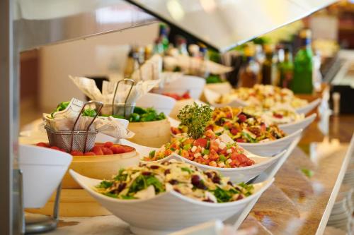 a buffet line with many different types of food at Hipotels Eurotel Punta Rotja Spa-Golf in Costa des Pins