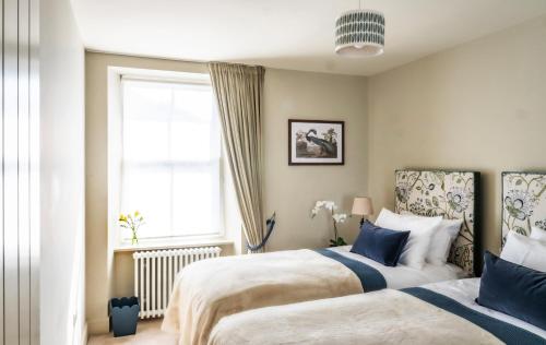 Postel nebo postele na pokoji v ubytování Bracken House