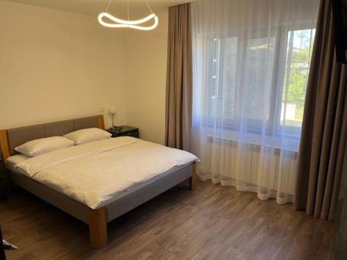 Ένα ή περισσότερα κρεβάτια σε δωμάτιο στο Мини-гостиница Три Коня