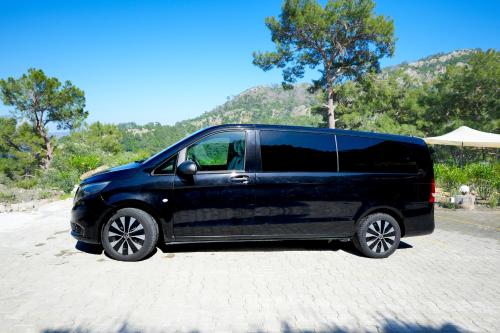 a black van parked on the side of a road at Ramitos Hotel in Turunc