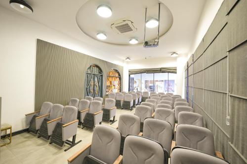 an empty room with rows of chairs in it at Ramitos Hotel in Turunc