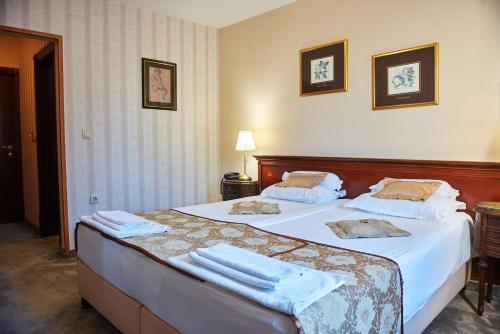 Garni Hotel Andricにあるベッド