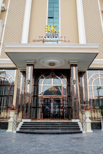a building with a staircase leading to a large doorway at LK Grand Empire in Pattaya South
