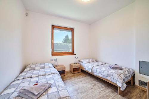 Posteľ alebo postele v izbe v ubytovaní Chalupa na Lipně - Holiday House 1