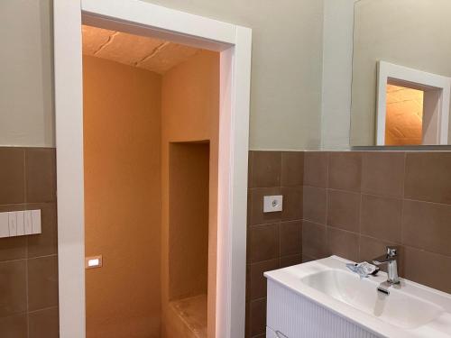 a bathroom with a sink and a mirror at Dimora Aquae Suites&Spa in Mola di Bari
