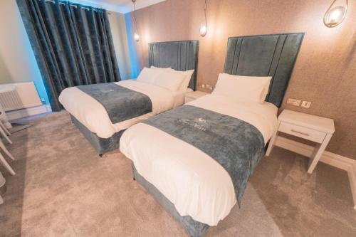 Postel nebo postele na pokoji v ubytování Tara Hotel
