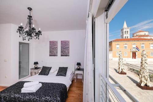 Posteľ alebo postele v izbe v ubytovaní Tinel Superior Residence