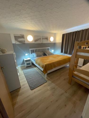 a bedroom with a large bed in a room at Ferienwohnung Sonnenschein in Dranske