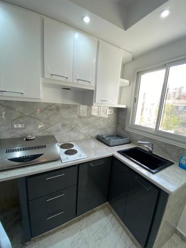 Kuchyň nebo kuchyňský kout v ubytování Duplex El mansoura A0