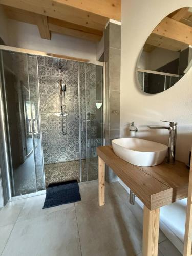 a bathroom with a tub and a sink and a shower at Chata Pluskacka in Velké Karlovice