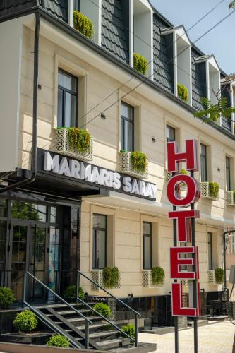 a hotel with a sign for the marriott saami at Marmaris Saray hotel NEW in Tashkent
