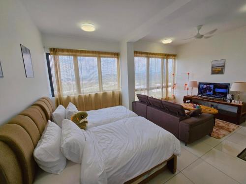 a bedroom with a bed with a teddy bear on it at Comfy Kiara Plaza Semenyih Broga Hill Sdio 5Pax in Semenyih