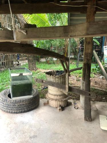 a stack of tires with a mirror on top of it at Sok Phen Homestay in Siem Reap