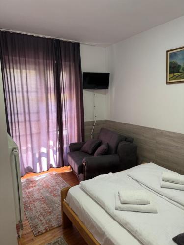 a living room with two beds and a couch at Lisine Ribnjak in Despotovac
