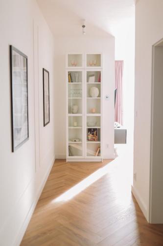 a hallway with a white cabinet in a room at Central Presov Bliss, right in the center with 1 free parking spot in Prešov