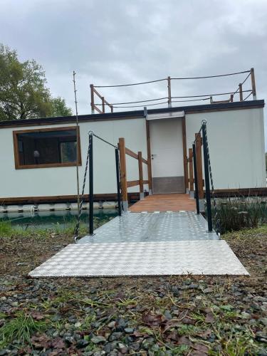 a house with a swing set in front of it at Floating Dream in Fiano