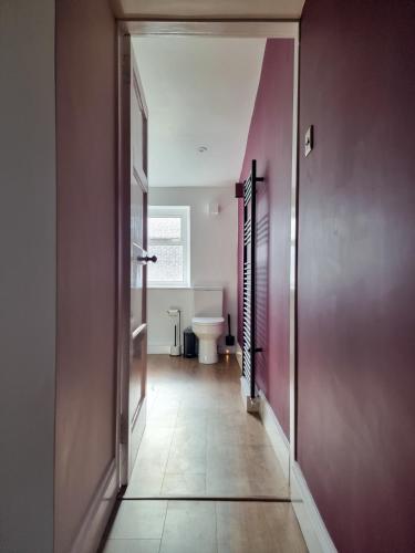 an empty hallway with a toilet in a room at West Lodge, High Street in Aberlour