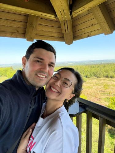 a man and a woman posing for a picture at Au Temps de Spa - La Tour du Tonnelet in Spa