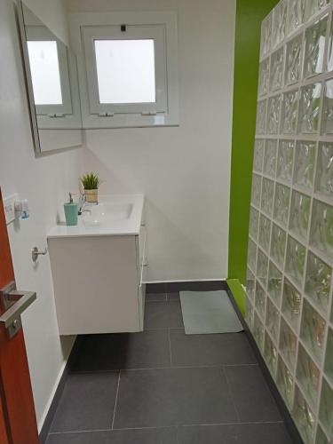 a bathroom with a sink and a mirror at Villa Pol Lanzarote in Puerto Calero