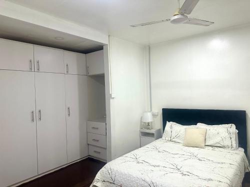 a bedroom with a bed and a ceiling fan at Large 3bdr Holiday Home Great Location Labasa Jumanzuls Abode in Labasa