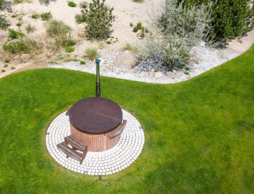 an overhead view of a fire pit in the grass at Villa Schmidt - Strandhaus direkt am Meer mit Sauna, Sport und Dünengarten I in Warnemünde