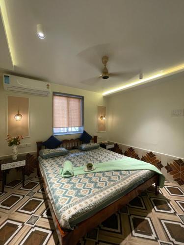 a bedroom with a large bed in a room at Zuluk Poolside Luxury Homestay with Swimming Pool in Ratnagiri