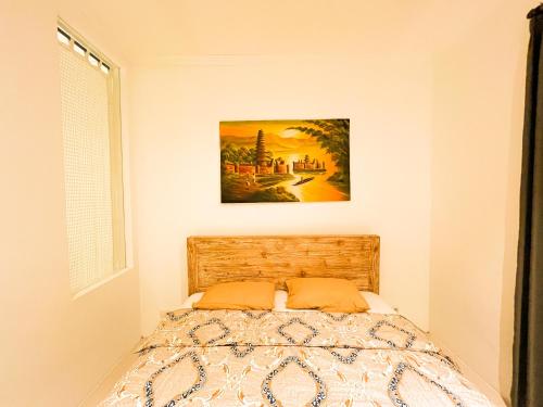 Postel nebo postele na pokoji v ubytování Alita Hotel Sanur