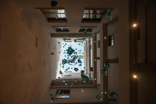 a hallway with a christmas tree in a building at Mitsis N'U Piraeus Port in Piraeus
