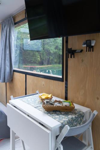 a white table in a room with a window at Floating Dream in Fiano