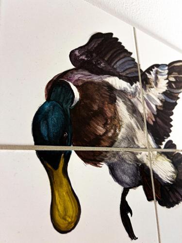 a drawing of a bird with its leg in the air at Pension Spreewelten in Lübbenau