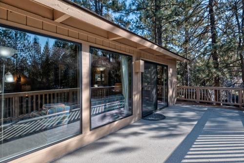 a house with glass windows on a balcony at Lynx - Unit 3 in Sunriver