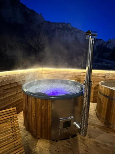 a jacuzzi tub with smoke coming out of it at Villa Melnik SPA Residence with Hot Pool by BookVillaBG in Melnik