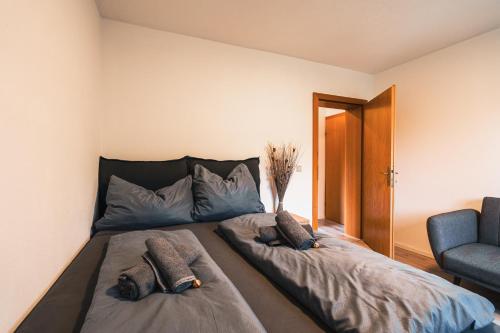 a bed in a room with two pillows on it at Zentral am Fluss #2 in Bad Ischl