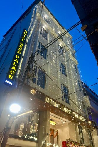 a building with lights on the side of it at hotel deep palace in Varanasi