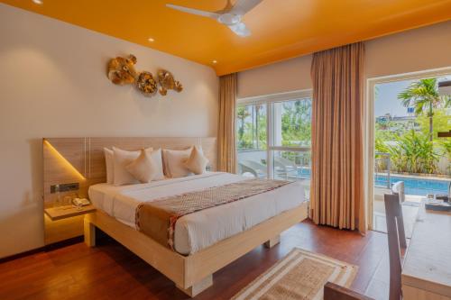 Letto o letti in una camera di Alaya Stays Gracias Retreat near Ashvem Beach 3 minutes Walk From The Beach