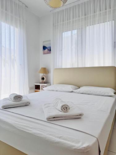 Ένα ή περισσότερα κρεβάτια σε δωμάτιο στο Nissini Wana Luxury Villa