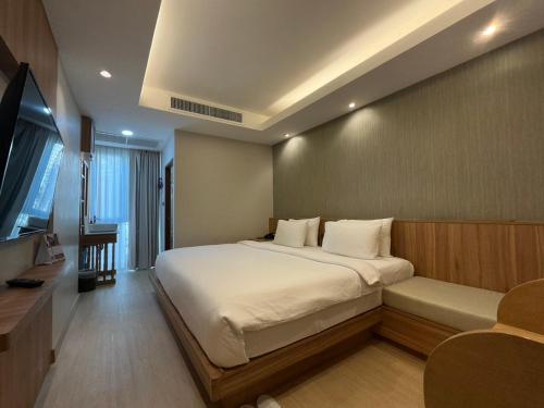 Una cama o camas en una habitación de Nine Hotel Chiangmai