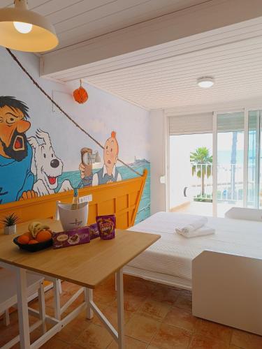 a bedroom with a painting on the wall at Cencibel - Harbor's Light in Villajoyosa