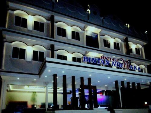 a building with a sign for the hotel binnan inn at Hotel Bintan Nirwana in Tanjung Pinang 