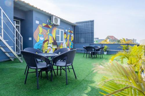 a patio with chairs and a table on a building at Housr Sector 42 Gurgaon Golf Course Road Near 42-43 Metro Station in Gurgaon