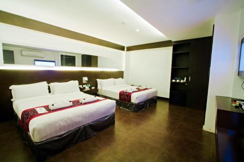 Postel nebo postele na pokoji v ubytování Hotel Fina