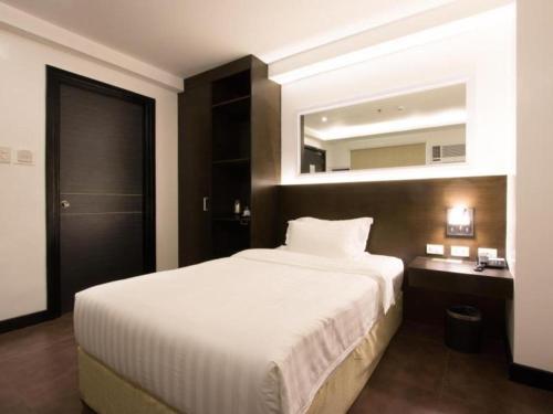 Postel nebo postele na pokoji v ubytování Hotel Fina